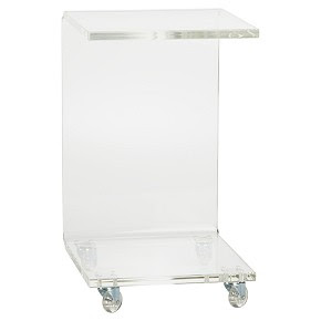 Lucite side table on wheels from cb2