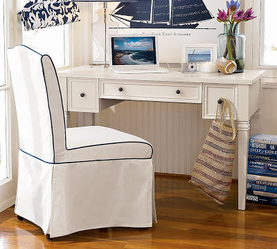 White hardwood desk with tapered legs and molded drawer fronts from Pottery Barn