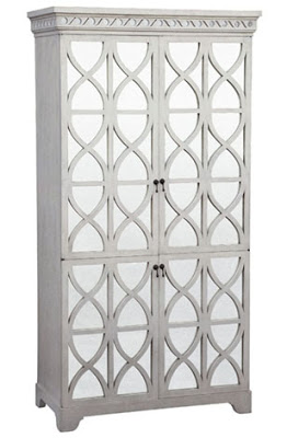antiqued white one piece entertainment center with antiqued mirror split doors from Mecox Gardens