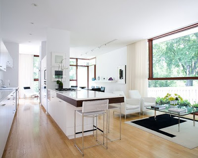 White modern open plan kitchen and living room with large picture window
