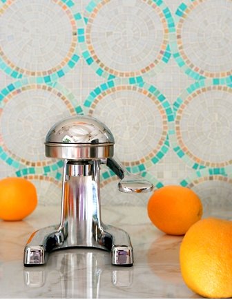 SICIS glass mosaic tile backsplash arranged in a circular pattern and marble countertop