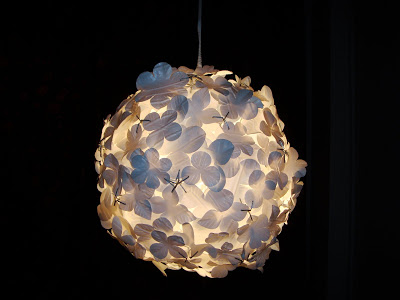 Round ceiling pendant light covered in flowers