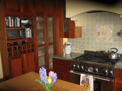 Kitchen after remodeling with a tile backsplash by Craig Antrim