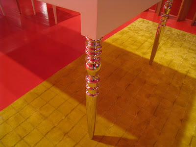 Close up of a silver leg on a restaurant table from Cappellini