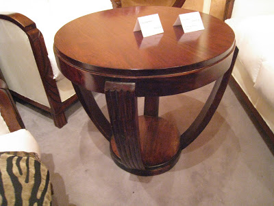 Dark wood mahogany side table with a base with curved supports