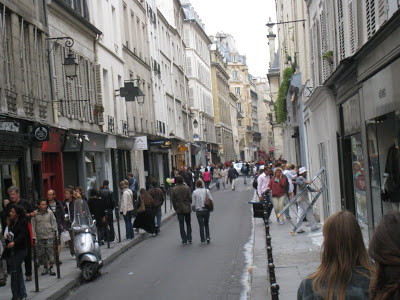 Street scene in front of Hier Pour Demain on Rue des Francs-Bourgeois in Paris