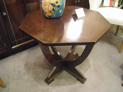 Dark wood mahogany side table with a base with curved supports
