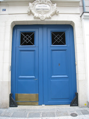 Electric blue door with tiny peep hole