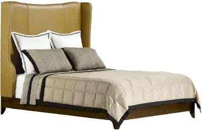 Wood bed frame with winged green leather headboard from Baker Furniture