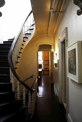 Home of a graphic designer and his fashion editor daughter with a very classic grand main staircase featured on The Selby 