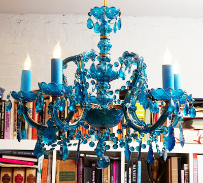 Blue glass chandelier in a NYC apartment featured on The Selby
