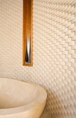 Bathrom with limestone tile arranged in a backset weave pattern from Ann Sack