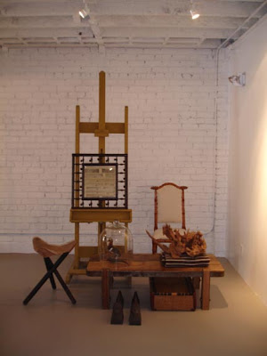 Vignette by NK Shop with lots of wood and leather furniture