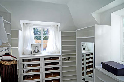 Master bedroom walk in closet after remodeling by Newman & Wolen Design with built in shelving and drawers