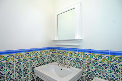 Powder room after remodeling by Newman & Wolen Design with blue, teal and white Spanish tiles