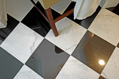 Black and white marble tile floor in a master bathroom remodeled by Newman & Wolen Design