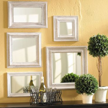 Five white washed molded wood framed mirrors from Ballard Designs