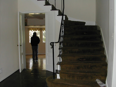 Entryway and staircase prior to Newman & Wolen Design's remodeling