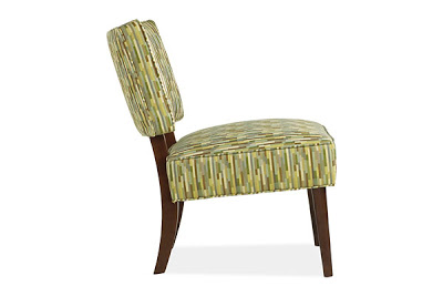 Chair upholstered in green retro Speed fabric with stained wood legs