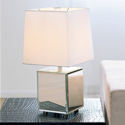 Table lamp with a white shade and reflective metal base from West Elm