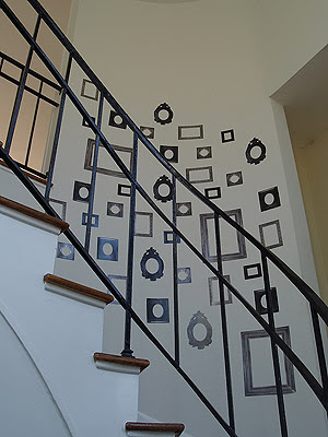 Frame wall decals and stickers in a stairwell designed by Vanessa de Vargas