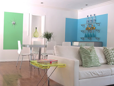 Bright modern living and dining room designed by Vanessa de Vargas with blue and green blocks of color on white walls