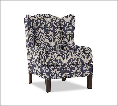 Upholstered desk chair with high back and roll back arms and blue and white ikat pattern from Pottery Barn