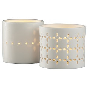 Two white eyelet porcelain candle holders from cb2
