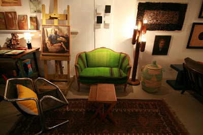 1940s settee upholstered in green hemp linen and a Moroccan rug in NK Shop