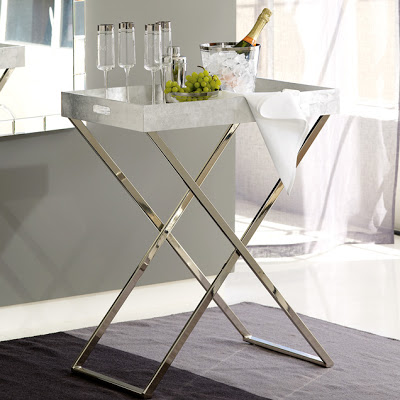X-bench with polished chrome legs and a grey top from West Elm