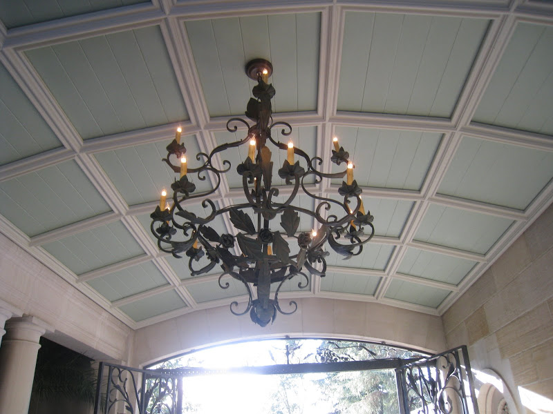 Wrought iron scroll work chandelier in the covered entry to the Greystone Estate