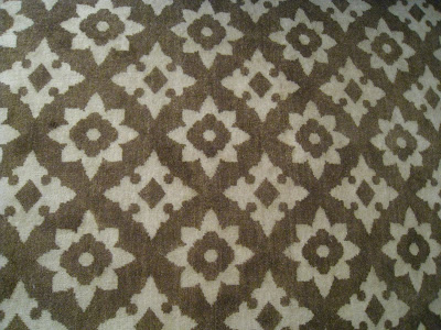 The Rug Company's Ushak Morocco rug in light brown and off white in a guest bedroom in the Greystone Mansion