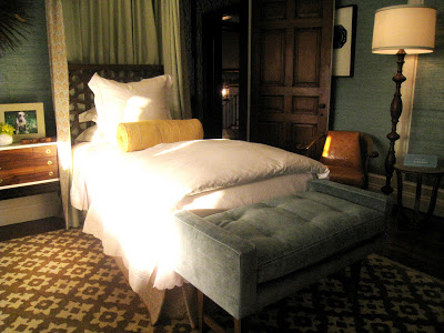 Custom Tiffany blue velvet tufted benches sit at the end of each twin bed in a guest bedroom in the Greystone Mansion
