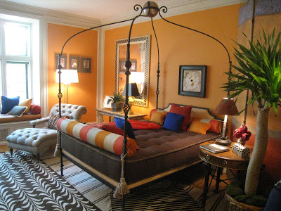 Gentelman's Atelier at the Greystone Mansion with bright orange walls and patterned rugs by James Lumsden