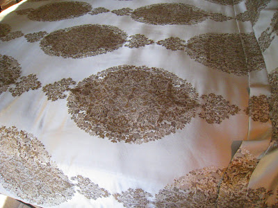 Silky cream beading with embellished gold brocade pattern in the master bedroom at the Greystone Mansion
