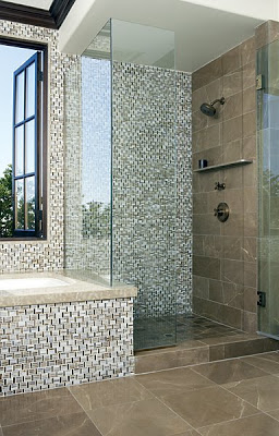 Bathroom with the shower and sunken tub covered in Erin Adams' triple basket weave glass mosaic and Suede limestone field tiles