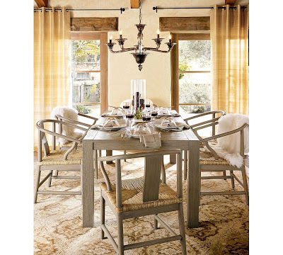Five arm chandelier made of smoked glass from Pottery Barn in a dining room