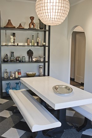 Breakfast nook after remodeling by Newman & Wolen Design with plaid tile floor and modern picnic style table and benches