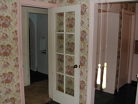 Breakfast nook with floral wallpaper prior to remodeling by Newman & Wolen Design