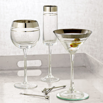Clear champagne glass, a wine glass and a martini glass rimmed with platinum silver stripes from West Elm