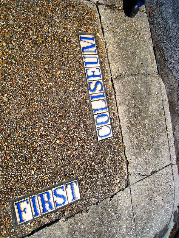 Tile street markers on a sidewalk in New Orleans