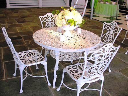 White metal table and outdoor chairs at a wedding by Delaney Todd Bagwell