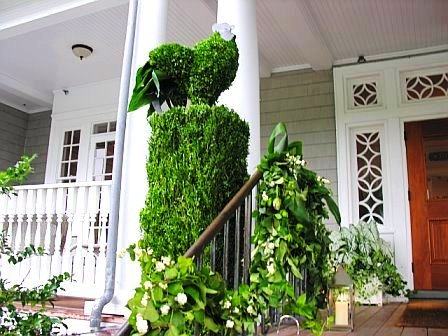 Close up of a bird inspired topiary at a wedding designed by Delaney Todd Bagwell