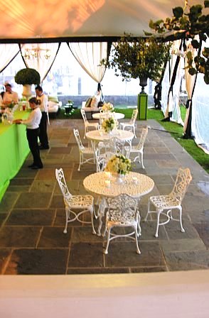 White metal table and outdoor chairs at a wedding by Delaney Todd Bagwell