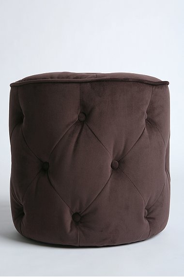 Brown tufted velvet round ottoman from Urban Outfitters