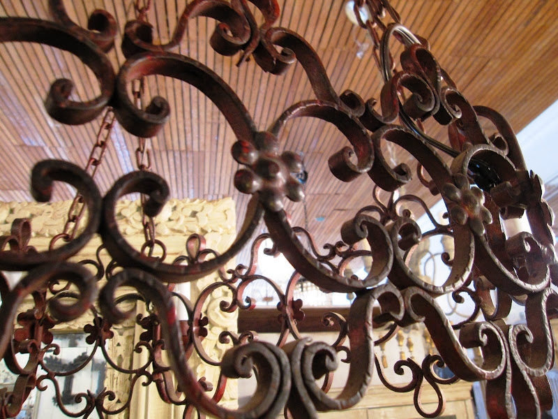 Close up of the details on a French Wrought Iron Chandelier at Pom Pom Interiors
