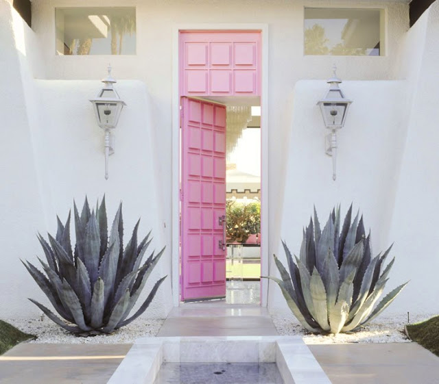 Pink raised panel front door at a Palm Springs home