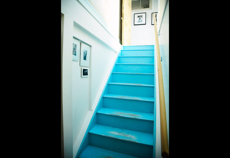 Worn turquoise stairs 