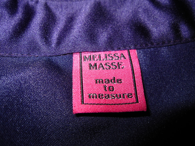 Close up of the Melissa Masse tag on a purple dress