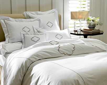 White bedding with Bourdon stitched flourish medallion and mitered flange finishes from William Sonoma Home